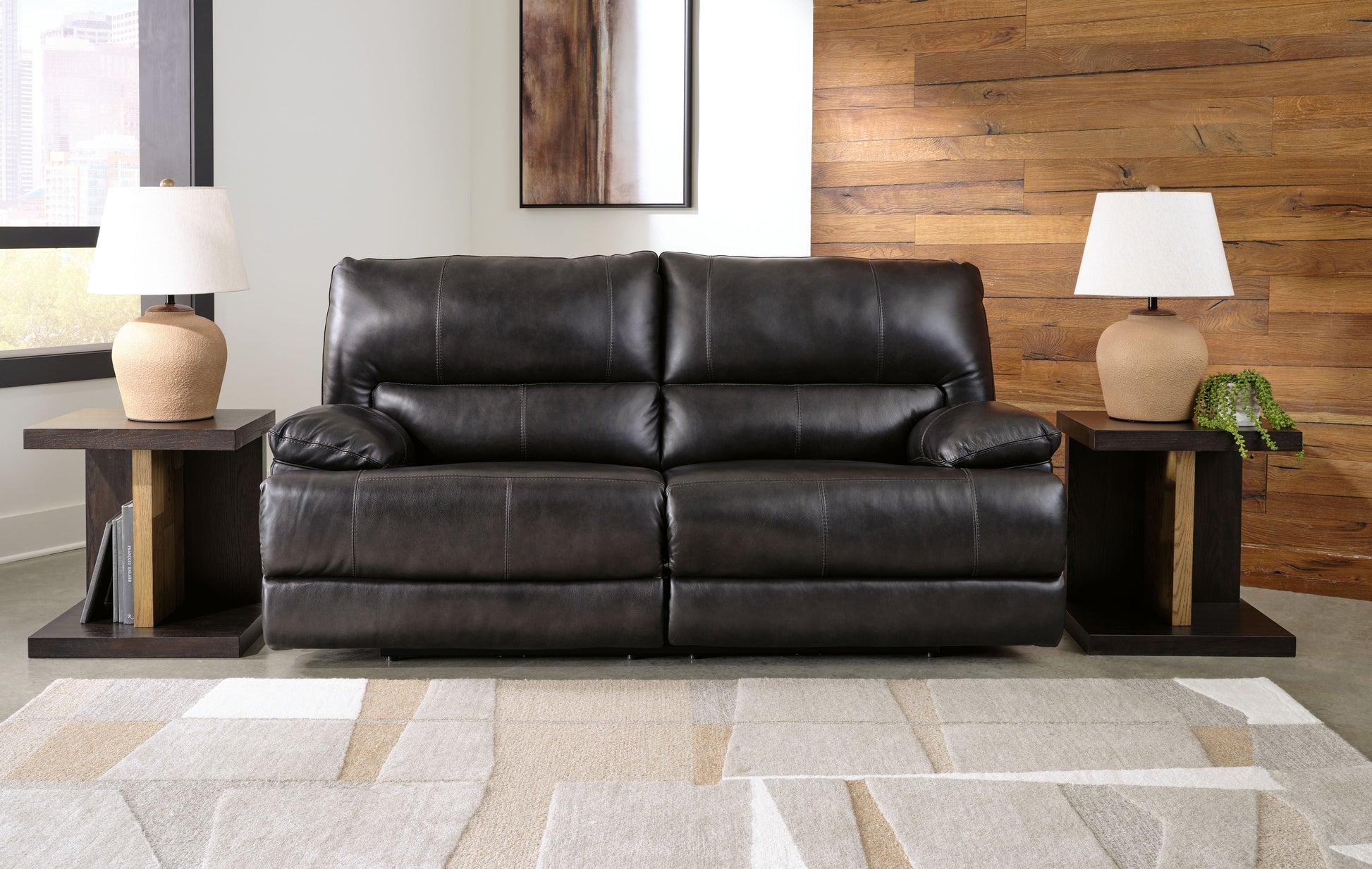 Black Leather Upholstered Reclining Sofa And Loveseat 7/18 - rear view